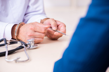 Male doctor in courthouse meeting with lawyer