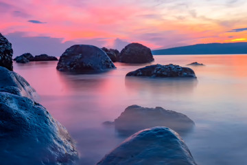 Fototapeta na wymiar sunset over the sea against the dramatic sky