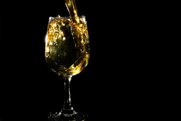 Splash of iced tea on black background