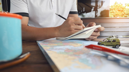 close up of a female hand writing on a notebook