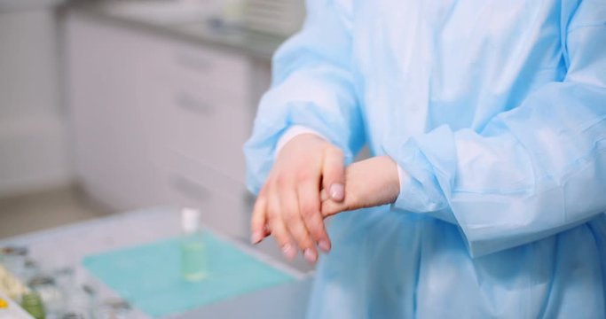 Doctor Disinfecting Hands with bactericidal gel