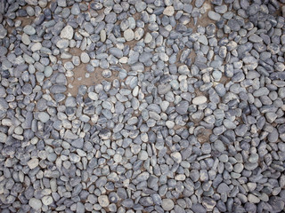 Coarse gravel texture stone on ground 