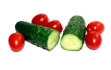 A cucumber and tomatoes isolated on a white background. Healthy food.