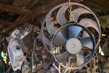 Old car spare parts for sale in garage