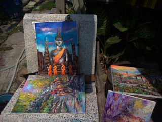 Oil painting in front of the Buddha statue   thailand
