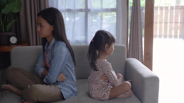 sibling different age fighting each other at home