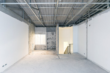 Construction site of empty Interior space, unfinished building after demolition process. Home...