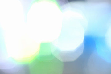 Blurred background of a night city glare and light of different colors of a defocused camera