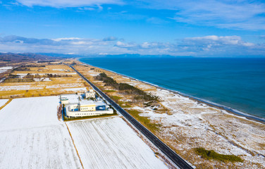 aerial view of landscape along the coastline of Hokkaido in winter time