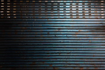 old blue metal door background with rust and degradation