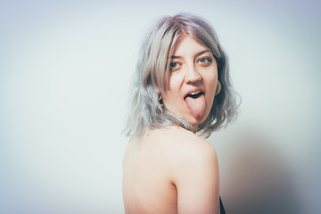 Woman showing tongue