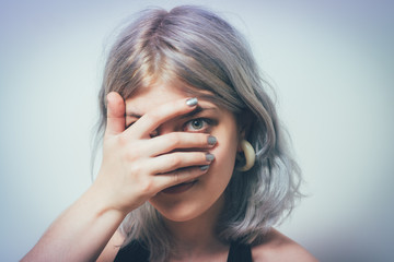  Woman covers his face by hand