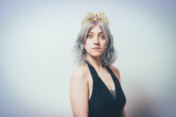 Naklejka premium Young woman and a princess, crown on his head