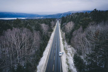 road trip across wild forest in Hokkaido in winter time