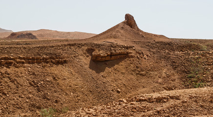 magmatic dike intrusion in the red orange sand and rock in wadi ardon near the ramat saharonim parking lot in the makhtesh ramon crater in israel