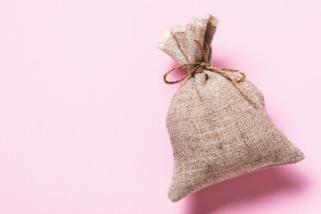 Full sack on pink background with copy space, top view