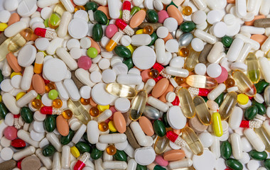Many colored pills and capsules. Background. Coronavirus pandemic. Space for text. Top view.