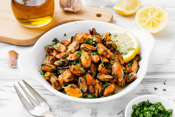 Delicious seafood mussels with lemon and parsley.