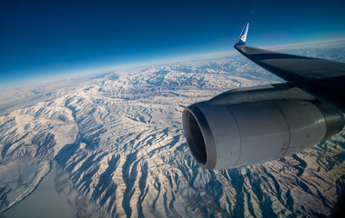 Snow mountain under the cloud in the plane