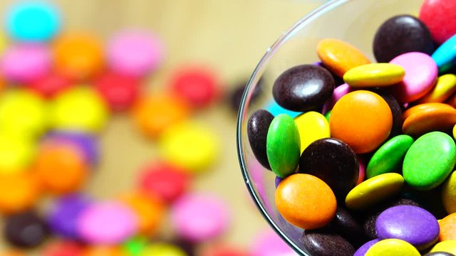 4K Multicolored, sweet chocolate candy on background