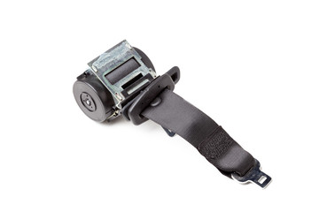 Spare part and interior element black seat belt from a car on a white isolated background. Auto service industry.