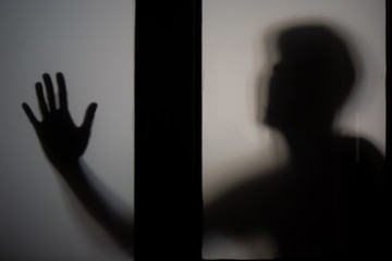 silhouette of person screaming for help