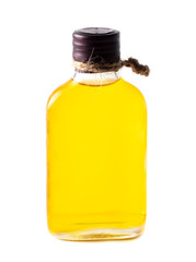 Yellow oil in a glass bottle isolated on a white