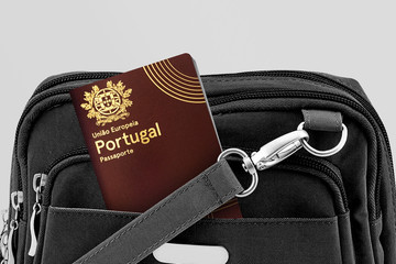 Close up of Portugal Passport in Black Travel Bag Pocket