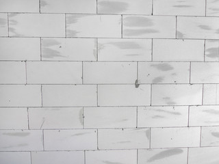 Wall made of aerated concrete blocks in daylight