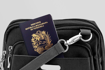 Close up of Venezuela Passport in Black Travel Bag Pocket