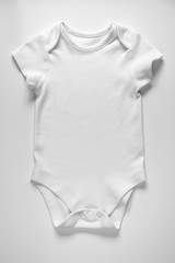 Baby's bodysuit isolated on white background/ Close-up/ Top-view/ Baby clothes 