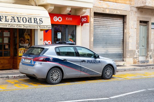 The Peugeot 308 police car of the MDINA - Il-Rabat Pulizija parked on the street in front of GO KVH reseller