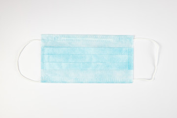 Antiviral medical mask for protection against coronavirus COVID-19. Medical protective mask on white background. Disposable surgical face mask cover the mouth and nose. Healthcare and medical concept.