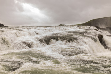 Spectacular powerful waterfall at rainy dull day