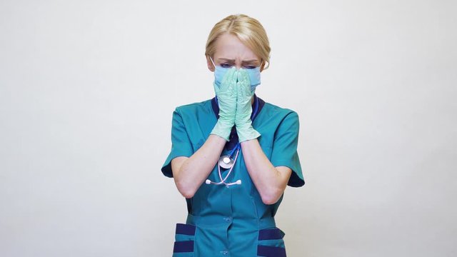 medical doctor nurse woman wearing protective mask and rubber or latex gloves - runny nose or flu