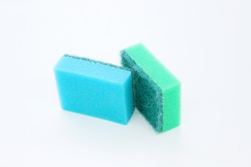 Multi-colored dishwashing sponges are placed on a white background