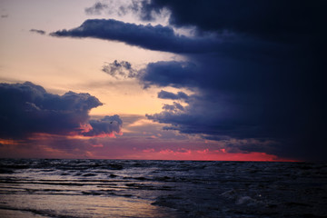 Dark cloudy sunset over the sea