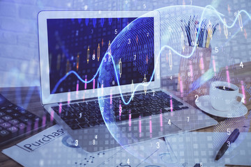 Financial graph colorful drawing and table with computer on background. Double exposure. Concept of international markets.