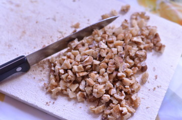 chopped walnuts on a chopping board