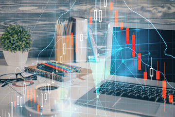 Financial market graph hologram and personal computer on background. Multi exposure. Concept of forex.