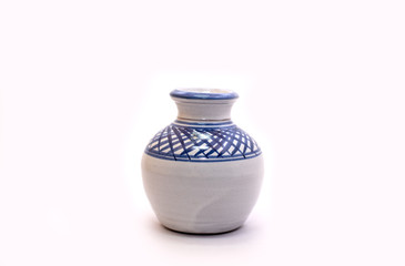 traditional decorated mini mud pot on white background