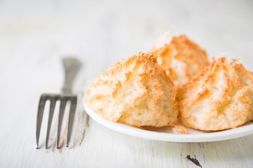 Homemade coconut cookies on a white table