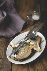 Whole baked mackerel with spices and herbs