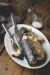 Whole baked mackerel with spices and herbs