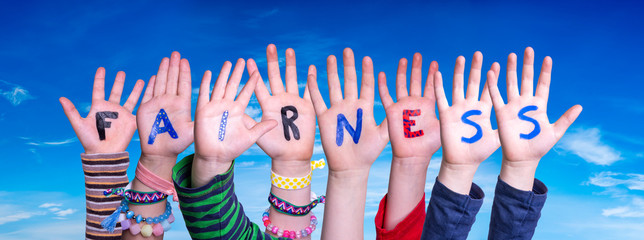 Children Hands Building Colorful Word Fairness. Blue Sky As Background