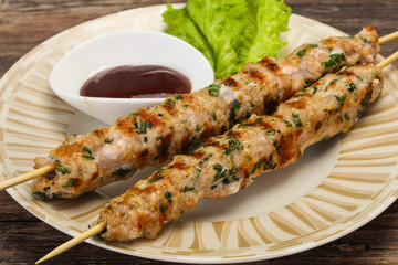 Minced pork skewer kebab with sauce