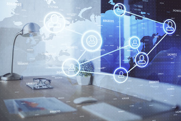 Computer on desktop with social network hologram. Multi exposure. Concept of international people connections.