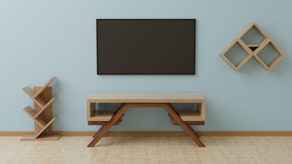 TV in the living room is on the blue wall, with a wooden table in front of it and hanging items on the side.