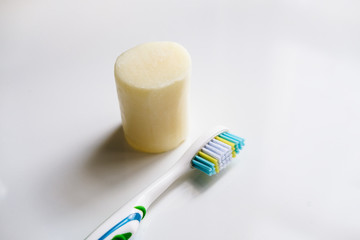 Zero waste solutions : removable head toothbrush, solid toothpaste and a glass.