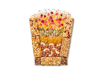 Granola bar with nuts and dry fruit berries in form of glass. Fitness diet super food. Energy cereal healthy snack. Muesli bars isolated on white. Creative design concept, top view